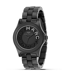 Get dazzled by the signature logo on MARC BY MARC JACOBS' oversized black plastic watch. Analog style with sweep second hand. Get dazzled by the signature logo on MARC BY MARC JACOBS' oversized black plastic watch. Analog style with sweep second hand.