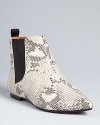 Pale snakeskin-embossed leather defines these SCHUTZ Chelsea booties, in a look that will always make a statement. With basic black or color, they'll freshly punctuate all your favorite fashions.