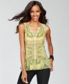 Try out the silhouette of the season -- the peplum -- with INC's exotic print top. A charming addition to any wardrobe.