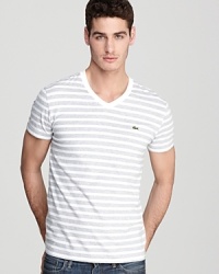 Hip trend-right stripes and a slim-fitting silhouette make Lacoste's V-neck tee an essential for your collection. Hip trend-right stripes and a slim-fitting silhouette make Lacoste's V-neck tee an essential for your collection.