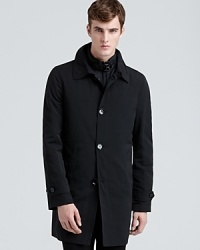 Burberry London modernizes the classic trench with a sleek, handsome design that features a detachable interior vest for unexpected versatility, yet is lined in the familiar check pattern for a through-line with the brand's heritage tradition. Burberry London modernizes the classic trench with a sleek, handsome design that features a detachable interior vest for unexpected versatility, yet is lined in the familiar check pattern for a through-line with the brand's heritage tradition.
