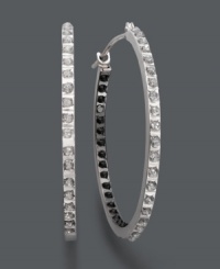 Expect the unexpected. Onlookers will do a double take when they catch a glimpse of these non-traditional hoop earrings. White diamond accents decorate the outside, while black diamond accents highlight the inside. Crafted in 14k white gold. Approximate diameter: 1-2/16 inches. Expect the unexpected. Onlookers will do a double take when they catch a glimpse of these non-traditional hoop earrings. White diamond accents decorate the outside, while black diamond accents highlight the inside. Crafted in 14k white gold. Approximate diameter: 1-2/16 inches.