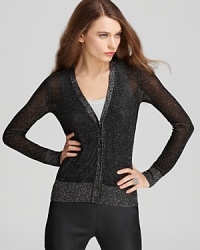 Classic prep meets rocker chic as a splash of shimmer elevates the essential Tory Burch cardigan. Classic prep meets rocker chic as a splash of shimmer elevates the essential Tory Burch cardigan.