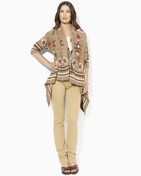 A Southwestern-inspired cardigan is knit in lightweight linen and finished with a bold allover pattern. A Southwestern-inspired cardigan is knit in lightweight linen and finished with a bold allover pattern.