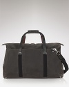 A handsome travel companion, this soft duffle makes toting your essentials a stylish affair.