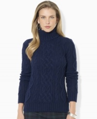 Lauren Jeans Co.'s chunky cable-knit sweater is crafted in a classic turtleneck silhouette. Lauren Jeans Co.'s chunky cable-knit sweater is crafted in a classic turtleneck silhouette.