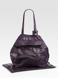 You'll want to get your hands on this plush and polished nod to an everyday diaper bag in light, soft leather with an outer pocket, snap flap pocket, inner compartments and pockets, removable water-resistant lining, antique brass hardware, plus a matching reversible changing pad.Two top handles You'll want to get your hands on this plush and polished nod to an everyday diaper bag in light, soft leather with an outer pocket, snap flap pocket, inner compartments and pockets, removable water-resistant lining, antique brass hardware, plus a matching reversible changing pad.Two top handles