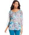Charter Club's semi-sheer top features a floral print for a feminine touch. Pair it with colored jeans for on-trend style.