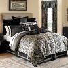 A regal damask pattern in tones of black, charcoal and tan, accented with shams and decorative pillows in rich fabrics and detailed trim create a dramatic collection. The bedskirt is in taffeta with inset gold panels.