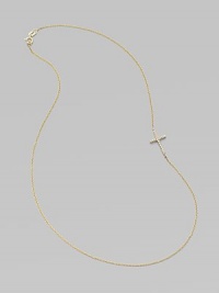 A wispy chain of 14k yellow gold features a cross pendant, encrusted in sparkling diamonds, set askew for a modern edge.Diamonds, .14 tcw 14k yellow gold Length, about 16 Pendant length, about ½ Spring ring clasp Made in USA