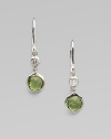 From the Silver Rain Collection. A lovely peridot, richly faceted in a modern sterling silver setting, is capped by one shimmering diamond.Diamonds, .07 tcw PeridotSterling silverDrop, about 1Ear wireImported