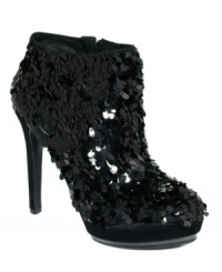 Vince Camuto's Dira platform booties feature all-over sequins for a look that's as festive as it is luxurious. Vince Camuto's Dira platform booties feature all-over sequins for a look that's as festive as it is luxurious.