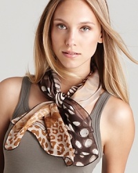 Look fierce in this zebra and cheetah printed scarf from Salvatore Ferragamo. Look fierce in this zebra and cheetah printed scarf from Salvatore Ferragamo.