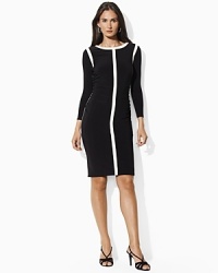 Mod contrast stripes and delicate ruching creating a flattering, curve-conscious silhouette on a sleek matte jersey dress, finished with chic long sleeves for refined elegance. Mod contrast stripes and delicate ruching creating a flattering, curve-conscious silhouette on a sleek matte jersey dress, finished with chic long sleeves for refined elegance.