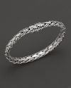 Shining sterling silver adds elegance to this hand-woven bracelet, finished with beautiful inner details.