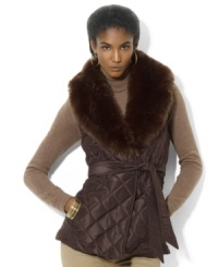 Lauren Ralph Lauren's quilted vest evokes equestrian style with a belted waist and luxurious trimmed collar for added elegance. Lauren Ralph Lauren's quilted vest evokes equestrian style with a belted waist and luxurious trimmed collar for added elegance.