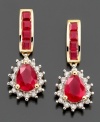 Heat up your look with sizzling style. Earrings feature pear-cut ruby (2-1/2 inches) and round-cut diamond (1/4 ct. t.w.) set in 14k gold. Approximate drop: 3/4 inch.