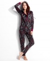 Warm and snuggly from head to toe. Kensie's hooded jumpsuit features contrasting cuffs and placket with a snap closure.