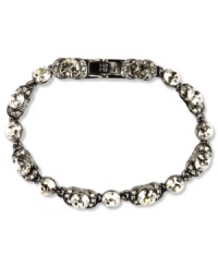 Sparkle with a little mood lighting. Swarovski crystals shine on Givenchy's flex bracelet. Crafted in hematite tone mixed metal. Approximate length: 7-1/4 inches.