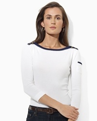 The cotton jersey Mickie top is infused with nautical inspiration, rendered with a contrasting bateau neckline and chic buttons at the shoulders. The cotton jersey Mickie top is infused with nautical inspiration, rendered with a contrasting bateau neckline and chic buttons at the shoulders.