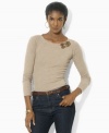 Lauren Ralph Lauren's figure-flattering petite boatneck top rendered in soft cotton is accented with a double buckle at the shoulder for a hint of rustic edge.