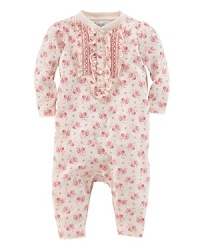 Finished with pretty ruffled accents, an adorable coverall is crafted in ultra-soft floral cotton jersey. Finished with pretty ruffled accents, an adorable coverall is crafted in ultra-soft floral cotton jersey.