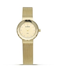 Gold-plated mesh bracelet watch from Skagen with a faceted dial and crystal markers. This understated timepiece boasts a slim profile and advanced Japanese quartz movement for a sleek combination of form and function. Gold-plated mesh bracelet watch from Skagen with a faceted dial and crystal markers. This understated timepiece boasts a slim profile and advanced Japanese quartz movement for a sleek combination of form and function.