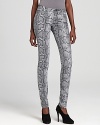 An elevated take on exotics, allover snakeskin print accentuates the sleek silhouette of these MICHAEL Michael Kors Petites jeans. Complete the look with polished booties and silver accents for untamed glamour.