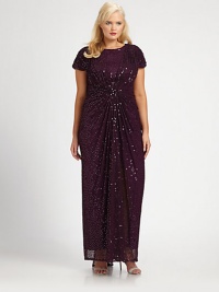Sequins adorn this gown for an instantly glamorous look. The gathered and ruched details ensure a flattering silhouette.Round neckShort sleevesGathered and ruched detailsFully linedAbout 53 from natural waistNylonDry cleanImported Sequins adorn this gown for an instantly glamorous look. The gathered and ruched details ensure a flattering silhouette.Round neckShort sleevesGathered and ruched detailsFully linedAbout 53 from natural waistNylonDry cleanImported