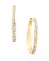 Sparkling diamond accents set within gleaming channels of 14k yellow gold punch up a classic style. Sparkling diamond accents set within gleaming channels of 14k yellow gold punch up a classic style.