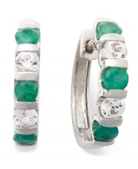 Perfect your look with enviable sparkle. These unique, channel-set hoop earrings feature round-cut emeralds (1-1/4 ct. t.w.) and white sapphires (9/10 ct. t.w.) in sterling silver. Approximate diameter: 21-1/2 mm x 20 mm.