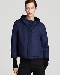 Brave the elements with style in this DKNY puffer coat, boasting a chic, cropped silhouette for modern sophistication.