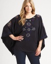 It's the poncho re-imagined with vivid embroidery, a relaxed fit and unquestionable charm.Round neckPull-on styleAbout 28 from shoulder to hemCottonMachine washImported