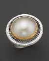 A cultured freshwater pearl is framed in a sterling silver & 24K gold setting with an ornate, organic feel. From Gurhan.