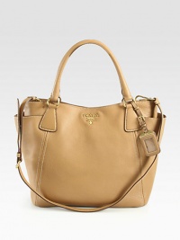 A supple leather style with a versatile detachable strap.Double top handles, 7 dropDetachable adjustable shoulder strap, 18½-20½ dropSnap button closureProtective metal feetTwo outside open pocketsOne inside zip pocketOne inside open pocketLogo lining12½W X 11½H X 5½DMade in Italy A supple leather style with a versatile detachable strap.Double top handles, 7 dropDetachable adjustable shoulder strap, 18½-20½ dropSnap button closureProtective metal feetTwo outside open pocketsOne inside zip pocketOne inside open pocketLogo lining12½W X 11½H X 5½DMade in Italy