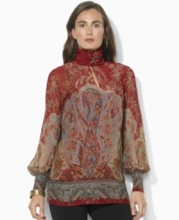 Lauren Ralph Lauren's breezy blouse is finished with a buttoned mockneck and elegant puffed sleeves. Lauren Ralph Lauren's breezy blouse is finished with a buttoned mockneck and elegant puffed sleeves.