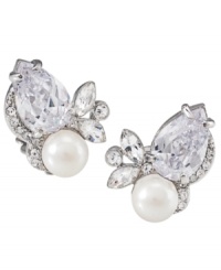 Glittering and glamorous! Enhance your evening style with these beautiful button earrings from Carolee. Combining simulated pearls with sparkling glass accents, they're set in silver tone mixed metal. Approximate diameter: 1-1/2 inches by 3/4 inch. Glittering and glamorous! Enhance your evening style with these beautiful button earrings from Carolee. Combining simulated pearls with sparkling glass accents, they're set in silver tone mixed metal. Approximate diameter: 1-1/2 inches by 3/4 inch.