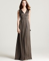 An elegant choice for day or night, this graceful Theory maxi dress fits close to your bodice