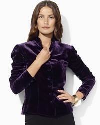 A lustrous velvet jacket is designed with a military-inspired buttoned placket and elegant puffed sleeves. A lustrous velvet jacket is designed with a military-inspired buttoned placket and elegant puffed sleeves.