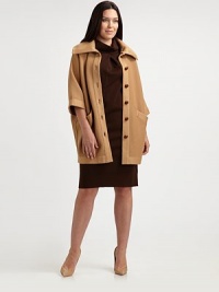 From its oversized collar to its finely ribbed texture, this knit cocoon coat is bound to make an amazing first impression. Channel an old Hollywood look and pair it with a pencil skirt.Oversized collarThree-quarter sleevesButton closureSlash pocketsAbout 33 from shoulder to hemWoolDry cleanMade in Italy From its oversized collar to its finely ribbed texture, this knit cocoon coat is bound to make an amazing first impression. Channel an old Hollywood look and pair it with a pencil skirt.Oversized collarThree-quarter sleevesButton closureSlash pocketsAbout 33 from shoulder to hemWoolDry cleanMade in Italy