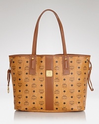 An updated and always luxe take on heritage style, this MCM tote flaunts a classic look with modern carryall credentials. An updated and always luxe take on heritage style, this MCM tote flaunts a classic look with modern carryall credentials.