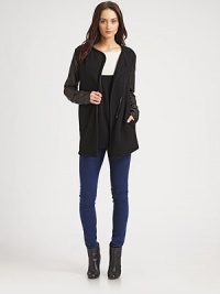 Designed with long leather sleeves, slash pockets and an asymmetrical zipper, this modern biker jacket hits below the hips. Asymmetrical zipperSlash pocketsLong leather sleevesAbout 29 from shoulder to hemBody: wool; trim: leatherDry clean with leather specialistMade in USA of imported fabricModel shown is 5'10 (177cm) wearing US size Small. Designed with long leather sleeves, slash pockets and an asymmetrical zipper, this modern biker jacket hits below the hips. Asymmetrical zipperSlash pocketsLong leather sleevesAbout 29 from shoulder to hemBody: wool; trim: leatherDry clean with leather specialistMade in USA of imported fabricModel shown is 5'10 (177cm) wearing US size Small.