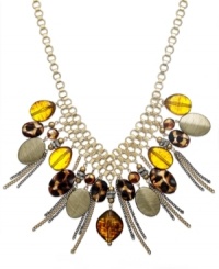 Go wild with this safari-inspired look from Style&co. Chains and animal printed beads dangle from mixed metal gold-tone chain. Approximate length: 18 inches + 2 inch extender. Go wild with this safari-inspired look from Style&co. Chains and animal printed beads dangle from mixed metal gold-tone chain. Approximate length: 18 inches + 2 inch extender.