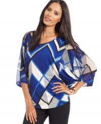 Style&co.'s top puts a fresh spin to your look with a bold geometric print.