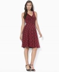 Traditionally rugged tartan looks utterly flirtatious on Lauren Ralph Lauren's lightweight surplice dress, designed with a sleeveless silhouette and soft gathers at the waist.