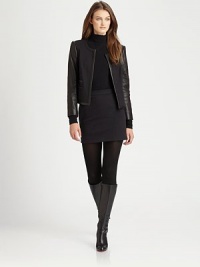A vision of edginess, this stretch mini features super-soft lambskin leather details and timeless waist darts for a fantastic fit.Leather side detailsBack waist dartsConcealed back zipperFully linedAbout 18 longCotton/nylon/elastaneDry clean by leather specialistImported Model shown is 5'10 (177cm) wearing US size 4. A vision of edginess, this stretch mini features super-soft lambskin leather details and timeless waist darts for a fantastic fit.Leather side detailsBack waist dartsConcealed back zipperFully linedAbout 18 longCotton/nylon/elastaneDry clean by leather specialistImported Model shown is 5'10 (177cm) wearing US size 4.