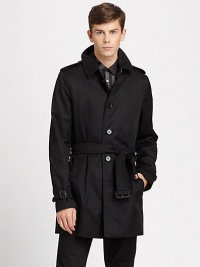 An understated style statement for those wintry days ahead, this classic trench is impeccably tailored from a crisp cotton blend, and features a turndown collar with hook closure at neck, storm flaps, belted cuffs and a check lining.Button frontShoulder epaulettesSide slash pocketsBelted waistBack ventCotton liningAbout 34 from shoulder to hemPolyester/cottonDry cleanImported An understated style statement for those wintry days ahead, this classic trench is impeccably tailored from a crisp cotton blend, and features a turndown collar with hook closure at neck, storm flaps, belted cuffs and a check lining.Button frontShoulder epaulettesSide slash pocketsBelted waistBack ventCotton liningAbout 34 from shoulder to hemPolyester/cottonDry cleanImported