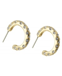 Crystal clear fashion. T Tahari blends golden tones with shimmering crystal studs on these hoop earrings. Crafted in gold tone mixed metal. Base metal is nickel-free for sensitive skin. Approximate diameter: 1 inch. Crystal clear fashion. T Tahari blends golden tones with shimmering crystal studs on these hoop earrings. Crafted in gold tone mixed metal. Base metal is nickel-free for sensitive skin. Approximate diameter: 1 inch.
