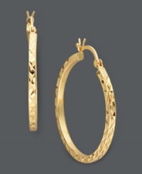 Simple, yet stunning. Giani Bernini's chic take on traditional hoop earrings incorporates a reflective diamond cut in 24k gold over sterling silver. Approximate diameter: 1-1/4 inches. Simple, yet stunning. Giani Bernini's chic take on traditional hoop earrings incorporates a reflective diamond cut in 24k gold over sterling silver. Approximate diameter: 1-1/4 inches.