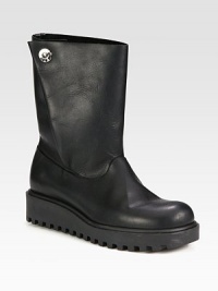 A sleek leather essential with a foldover snap detail and rubber trek sole for added traction. Rubber heel, 1¾ (45mm)Shaft, 8¼Leg circumference, 13Leather upperFoldover snap closureLeather liningRubber trek solePadded insoleImportedThis style runs true to size. We recommend ordering your usual size for a standard fit. A sleek leather essential with a foldover snap detail and rubber trek sole for added traction. Rubber heel, 1¾ (45mm)Shaft, 8¼Leg circumference, 13Leather upperFoldover snap closureLeather liningRubber trek solePadded insoleImportedThis style runs true to size. We recommend ordering your usual size for a standard fit.